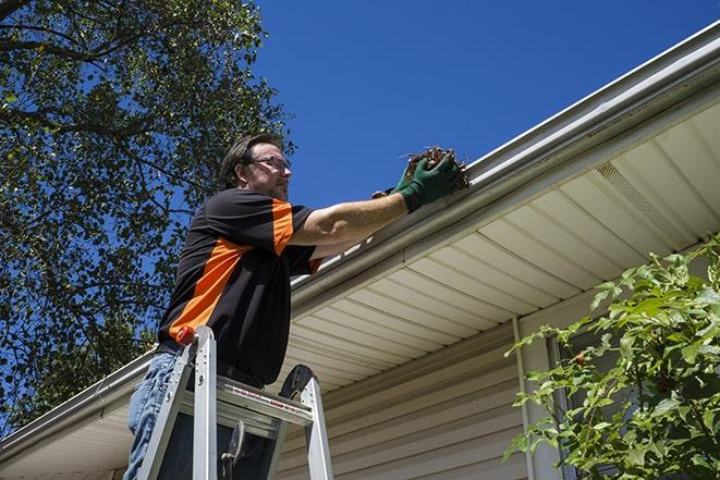damaged gutter being fixed with new materials in Millers Falls MA